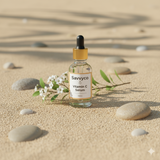 Savvyco Vitamin C Serum bottle on a sandy background
